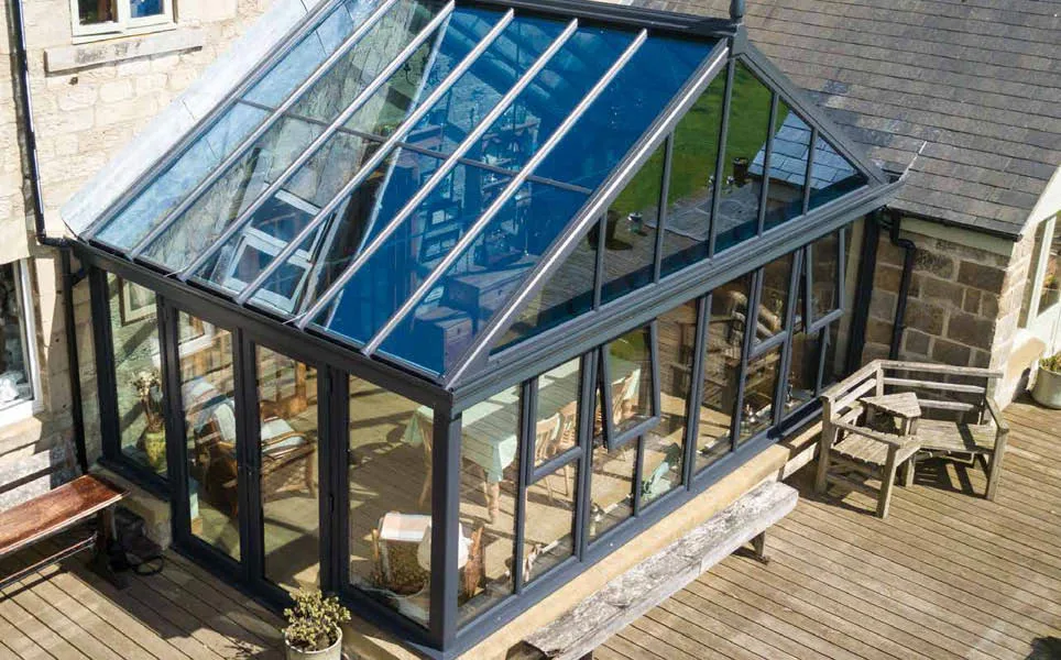 Glazed conservatory adjoining a stone property